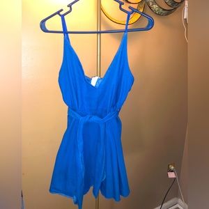 Short jean dress with straps.